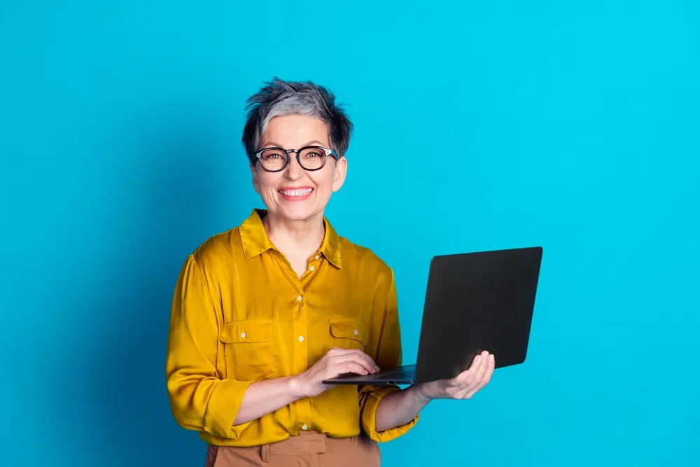 Photo,of,charming,positive,woman,wear,blue,blouse,eyeglasses,working